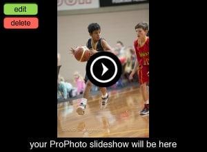 A player in a navy Canberra jersey drives past a defender in a red 'Rebels' jersey on court.