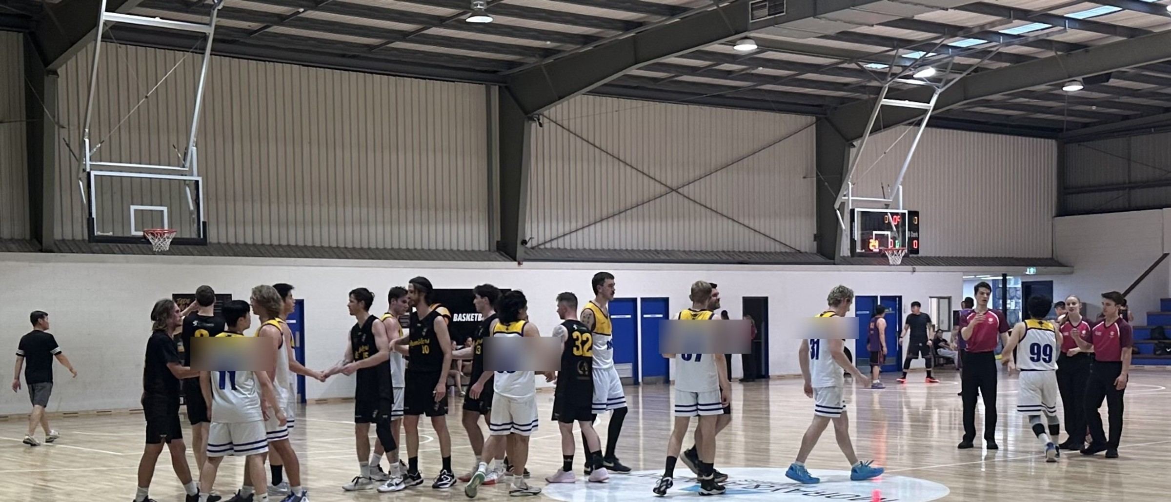 Ramblers senior players shake hands with the opposition after a game